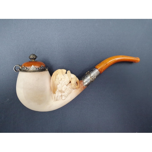 98 - A Meerschaum Pipe with bird of prey and deer, finely engraved mounts, another with female bust and f... 