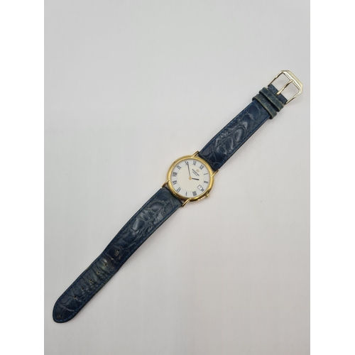 152 - A gentleman's 1990's Raymond Weil quartz Wristwatch the two tone white and cream dial with roman num... 