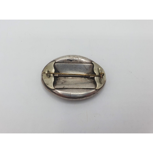 185 - A Georgian oval Mourning Brooch with lock of hair to centre within foil backed paste, approx 48mm wi... 