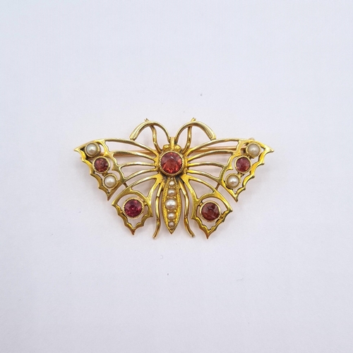 186 - A Pink Tourmaline and Seed Pearl Butterfly Brooch the openwork plaque millegrain-set five round tour... 