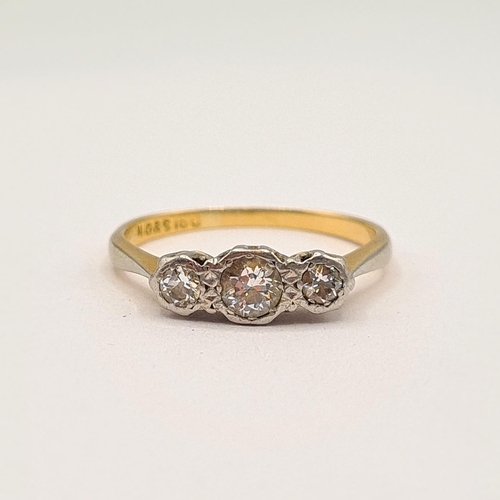 196 - A Diamond three stone Ring illusion-set graduated old-cut stones, stamped 18ct, ring size L