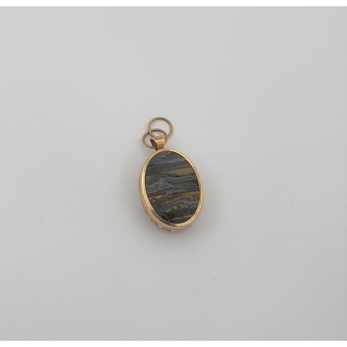 201 - A 9ct gold Fob set landscape agate and black onyx, approx 11.60gms