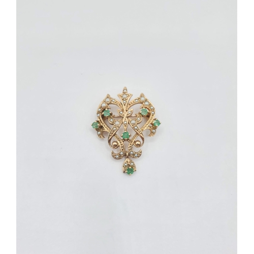 204 - An Emerald and Seed Pearl Pendant/Brooch the openwork plaque set six round emeralds and numerous see... 