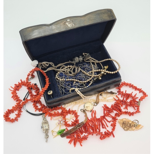 211 - An Italian leather Casket of Jewellery including; two coral necklaces and a string of freshwater pea... 