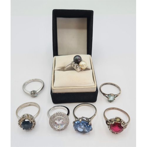 212 - A Cluster Ring set CZ in silver together with six various Dress Rings