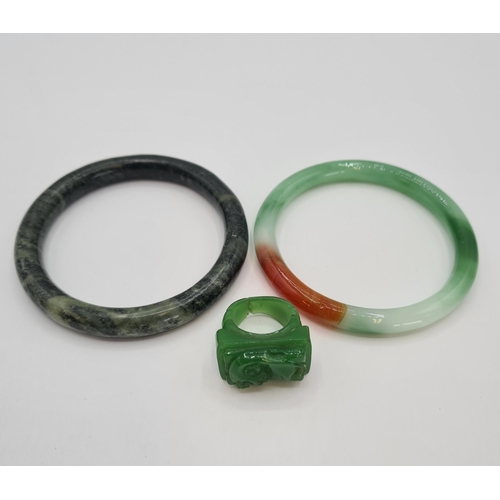 213 - A Jade type Ring and two Bangles