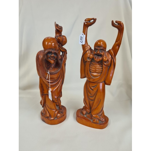 227 - Two modern Oriental wooden Figures