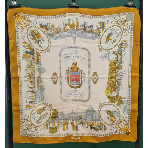 246 - A vintage Hermes silk Scarf; 'Promenades De Paris' groups of figures in front of landmarks in pastel... 