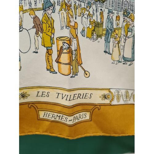 246 - A vintage Hermes silk Scarf; 'Promenades De Paris' groups of figures in front of landmarks in pastel... 