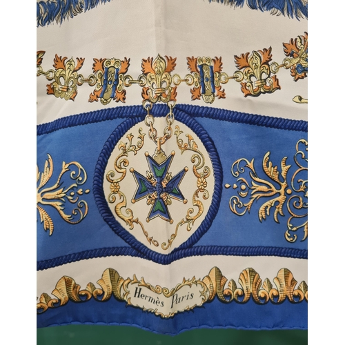 247 - A vintage Hermes silk Scarf; 'LVDVICVS MAGNVS' cavalier on rearing horse in blue and gold on ivory c... 