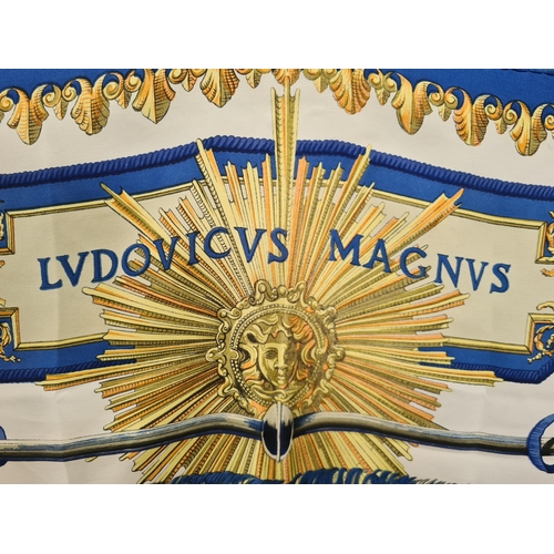 247 - A vintage Hermes silk Scarf; 'LVDVICVS MAGNVS' cavalier on rearing horse in blue and gold on ivory c... 