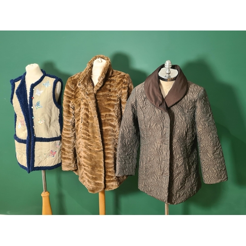 267 - A faux fur Jacket, various Coats, Hats etc