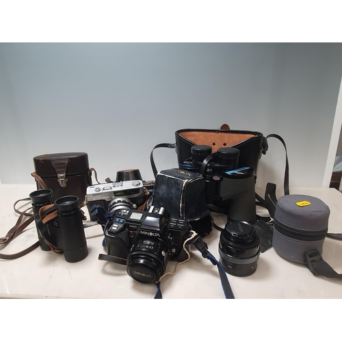 295 - A Petri 7s Camera, a Minolta 7000 Camera, a 35/70 Zoom Lens a pair of Swift Newport MkII Binoculars,... 