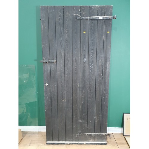 622 - A heavy Exterior Door with wrought iron hinges and a latch, 6ft 8in H x 3ft 1 1/2in W x 1 3/4in thic... 