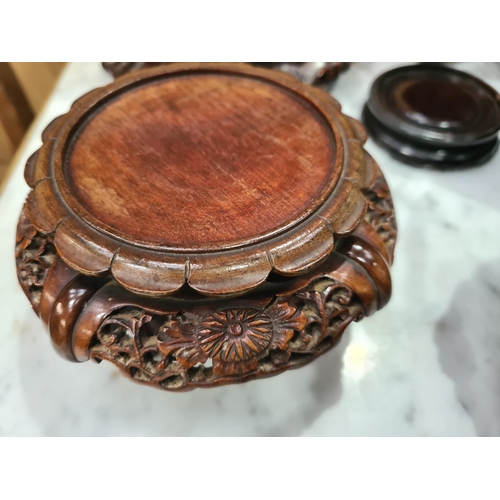 550 - A collection of twelve assorted hardwood Chinese Pot Stands some with pierced decorations and shaped... 