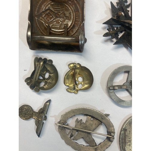 67 - A collection of Polish, German and Japanese Military Badges and other effects including Police Airfo... 