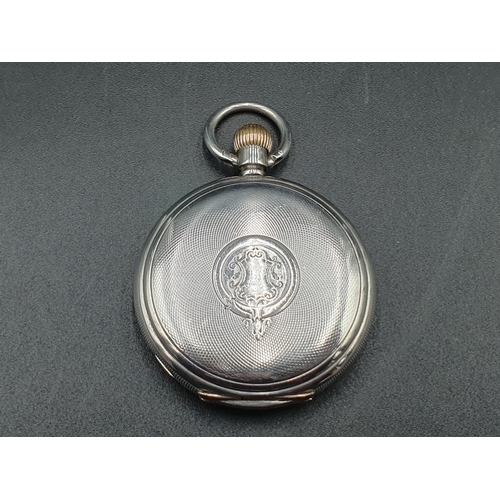 151 - A Baume Longines silver cased Hunter Pocket Watch with white enamel dial and subsidiary seconds dial... 