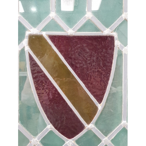 484 - A large leaded glass Window with pair of coloured glass Shield emblem decorations, 6ft 3