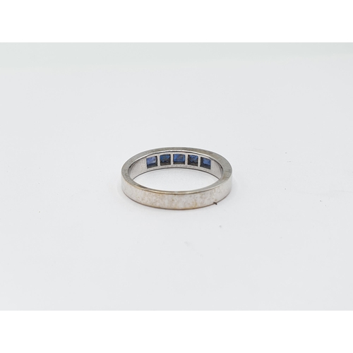 232 - A Sapphire five stone Ring channel-set baguettes in white gold stamped 18K, ring size N, approx 4.40... 