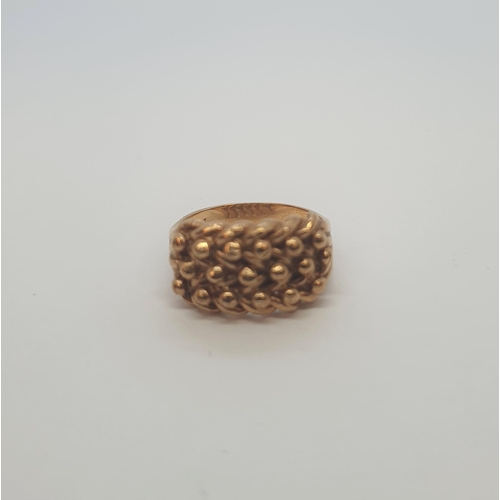 175 - A gold Keeper Ring stamped 9ct, ring size L 1/2, approx 6.70gms