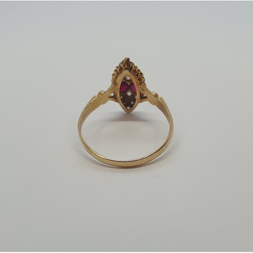 177 - An early 20th Century Ruby and Diamond Ring the marquise shaped plaque pavé-set two round rubies bet... 