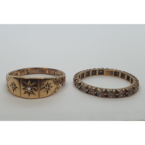 194 - An 18ct gold Ring set diamond chips and an Eternity Ring set synthetic spinel stamped 9ct