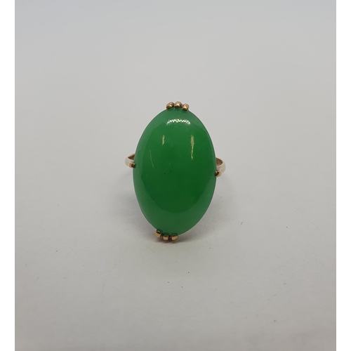 207 - A Jade Ring claw-set oval cabochon, Chinese gold marks, ring size K/L, approx 4.30gms