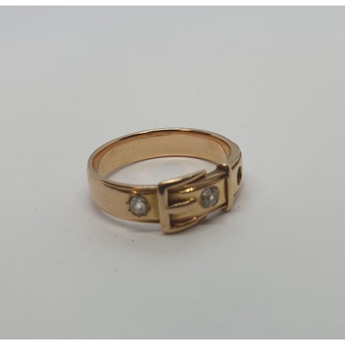 233 - A gold Buckle Ring set two old-cut diamonds, lacks one stone, untested. unmarked, ring size N 1/2, a... 