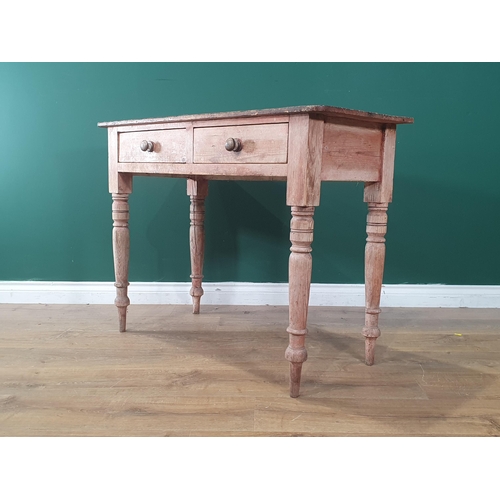 1 - A pine Side Table fitted two drawers, raised on turned and tapered supports, 2ft 6