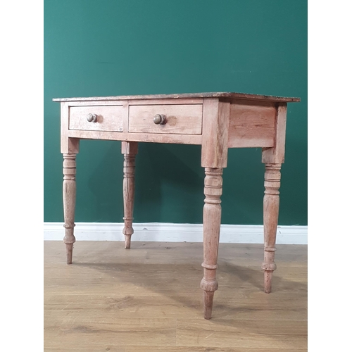 1 - A pine Side Table fitted two drawers, raised on turned and tapered supports, 2ft 6