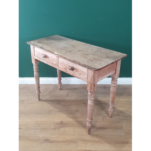 1 - A pine Side Table fitted two drawers, raised on turned and tapered supports, 2ft 6