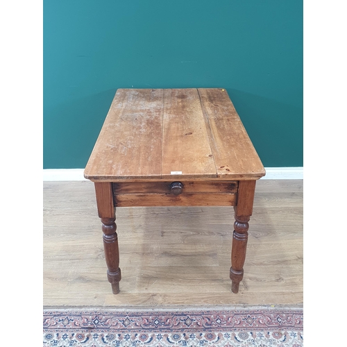 10 - A pine Kitchen Table with single fitted drawer raised on turned supports, 2ft 6in High x 4ft Long x ... 