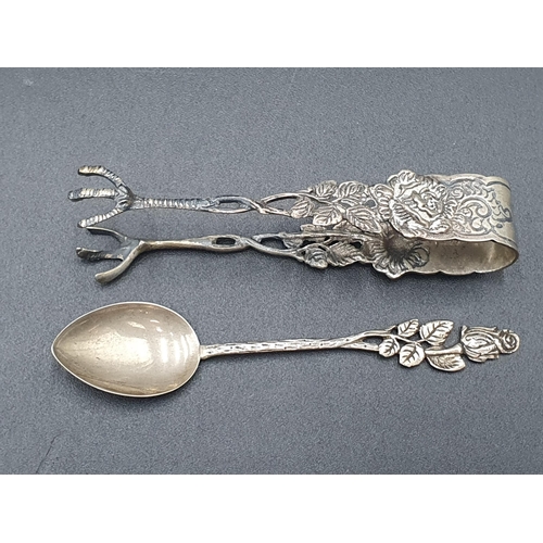 107 - A Set of ten Continental silver Coffee Spoons with flower finials, and a matching Ladle and Sugar Cl... 