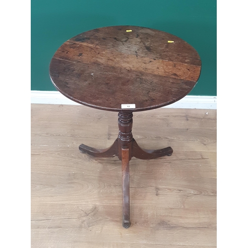 12 - An antique oak circular topped Tripod Table on turned column and splayed tripod supports. 29in High ... 