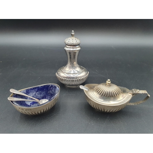 122 - An Elizabeth II Irish silver three piece Condiment Set of oval semi-fluted form, plus two Spoons, Du... 