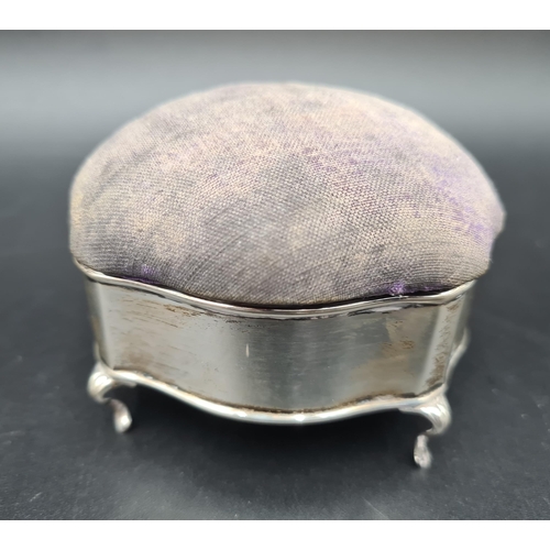 137 - A George V silver Trinket Box/Pin Cushion on four scroll feet, Birmingham 1910, and two silver mount... 