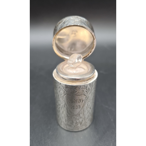 138 - A Victorian silver cylindrical Scent Bottle with  leafage scroll engraving, Birmingham 1899, and a p... 