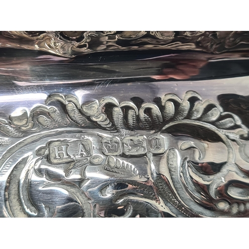 147 - A Victorian silver Bowl with gadroon and scroll embossing, vacant cartouche, on pedestal base, Sheff... 