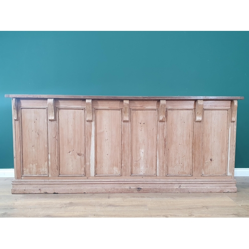 18 - A pine Shop Counter with mahogany top above six panel front, raised on moulded plinth base, 3ft High... 