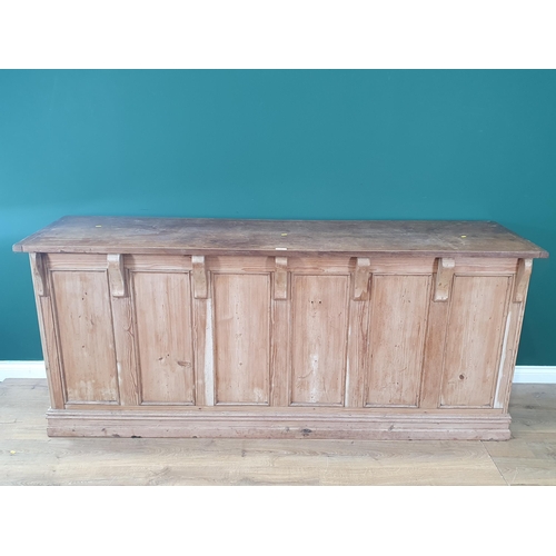 18 - A pine Shop Counter with mahogany top above six panel front, raised on moulded plinth base, 3ft High... 