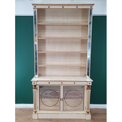 2 - A Regency Style cream painted Bookcase, the top section with adjustable shelves flanked by mirror up... 