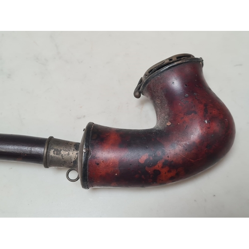 27 - An antique Pipe with hazel stem and briar bowl 1ft 3in L, a clay Pipe with figural bowl, stamped 'Lo... 