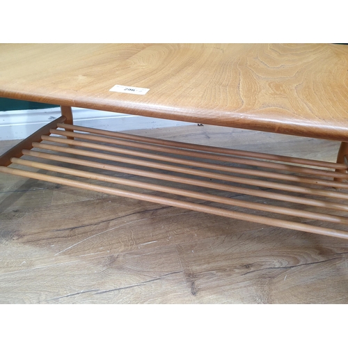 296 - An Ercol pale elm Coffee Table with rounded rectangular top and lower magazine shelf, 3ft 6in W x a ... 