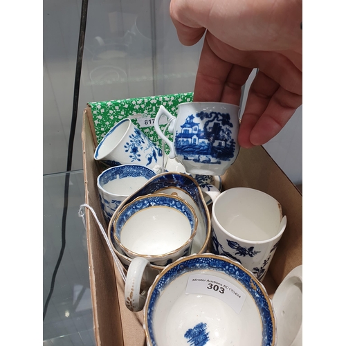 303 - Five assorted blue and white Coffee Cups, a Tea Bowl with two figures in white cartouche, an oval Ju... 