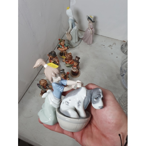 326 - A Lladro Figure of a Child washing a Dog, another Lladro Figure and another similar, and seven Humme... 