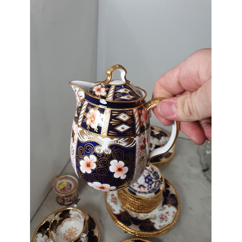 354 - A Coalport part Tea Service, painted and gilded on a dark blue ground, a Royal Crown Derby covered J... 