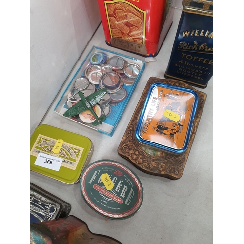 368 - A collection of Tins, and Badges