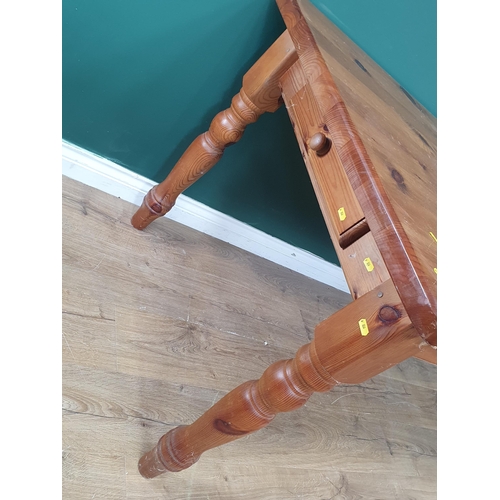 404 - A modern orange pine Kitchen Table with two fitted drawers, raised on turned supports, 2ft 7