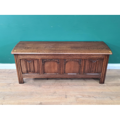 417 - A reproduction oak Blanket Chest with four panel front with applied decoration, 1ft 9