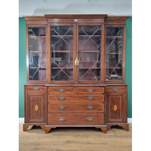 423 - A reproduction mahogany Breakfront Bookcase, the top with astragal glazed doors  enclosing adjustabl... 